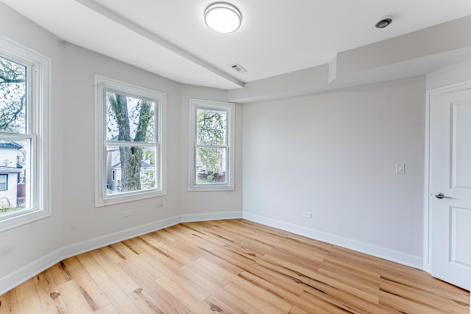 822 North Lockwood Avenue Chicago, IL 60651 - Photo 26 of 63 a view of an empty room with wooden floor and a window
