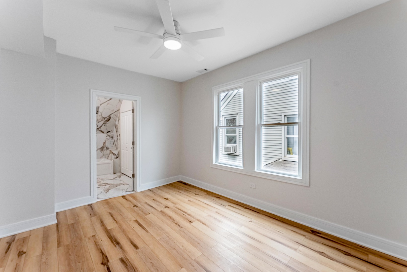 822 North Lockwood Avenue Chicago, IL 60651 - Photo 30 of 63 an empty room with windows