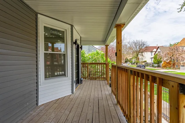 a view of a balcony with wooden floor
