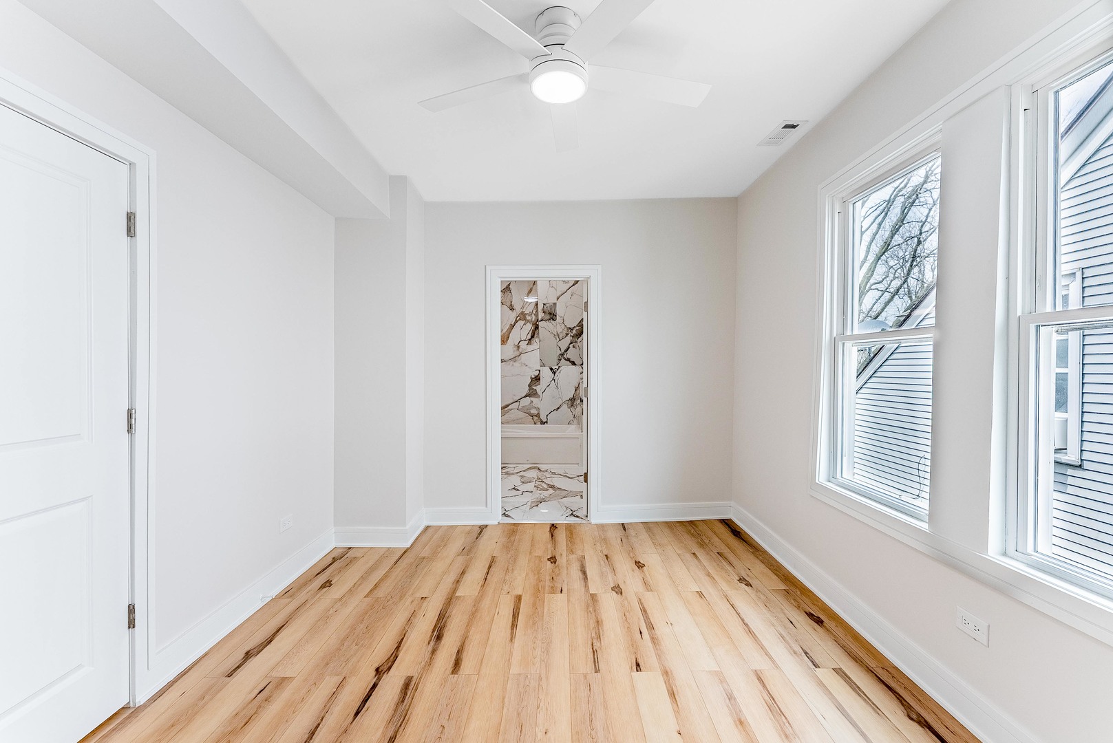 822 North Lockwood Avenue Chicago, IL 60651 - Photo 33 of 63 a view of a room with wooden floor closet and windows