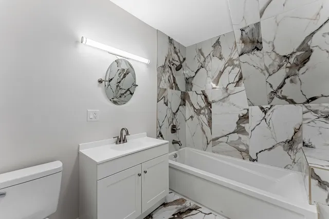 a view of a room with wooden floor and window