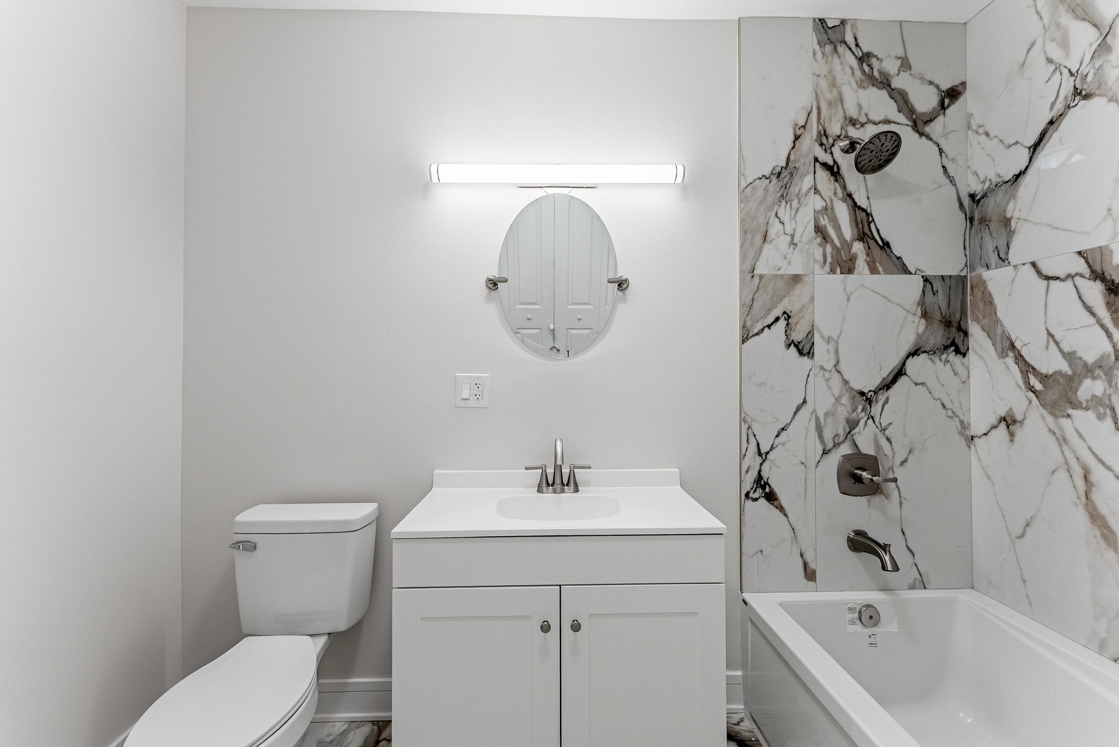 822 North Lockwood Avenue Chicago, IL 60651 - Photo 36 of 63 a bathroom with a sink a toilet and bathtub