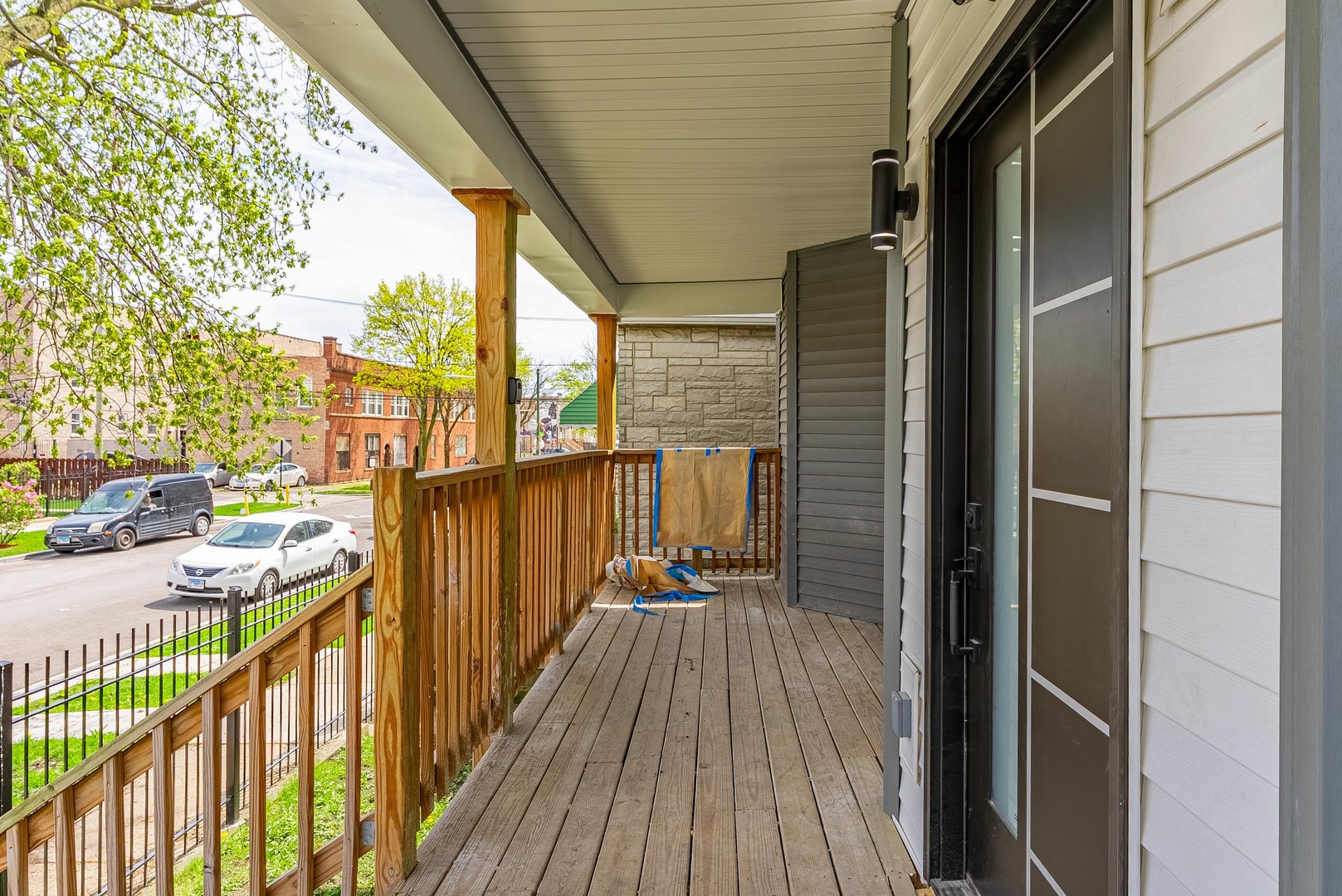 822 North Lockwood Avenue Chicago, IL 60651 - Photo 4 of 63 a view of a balcony with wooden floor