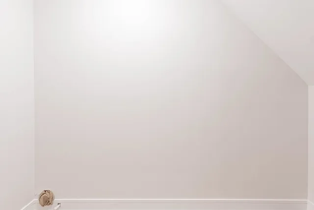 a view of wooden floor and windows in a room