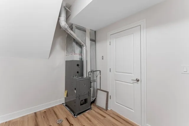 a view of an empty room and wooden floor