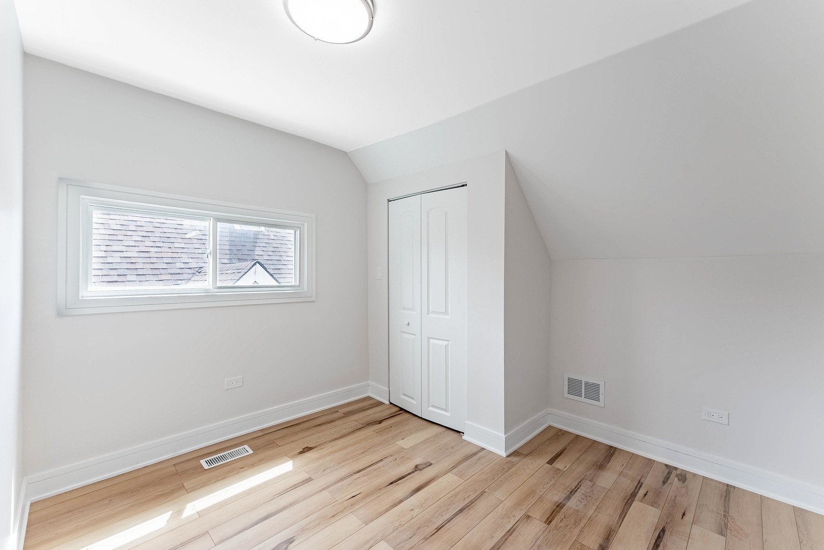 822 North Lockwood Avenue Chicago, IL 60651 - Photo 45 of 63 a view of a room with wooden floor and window