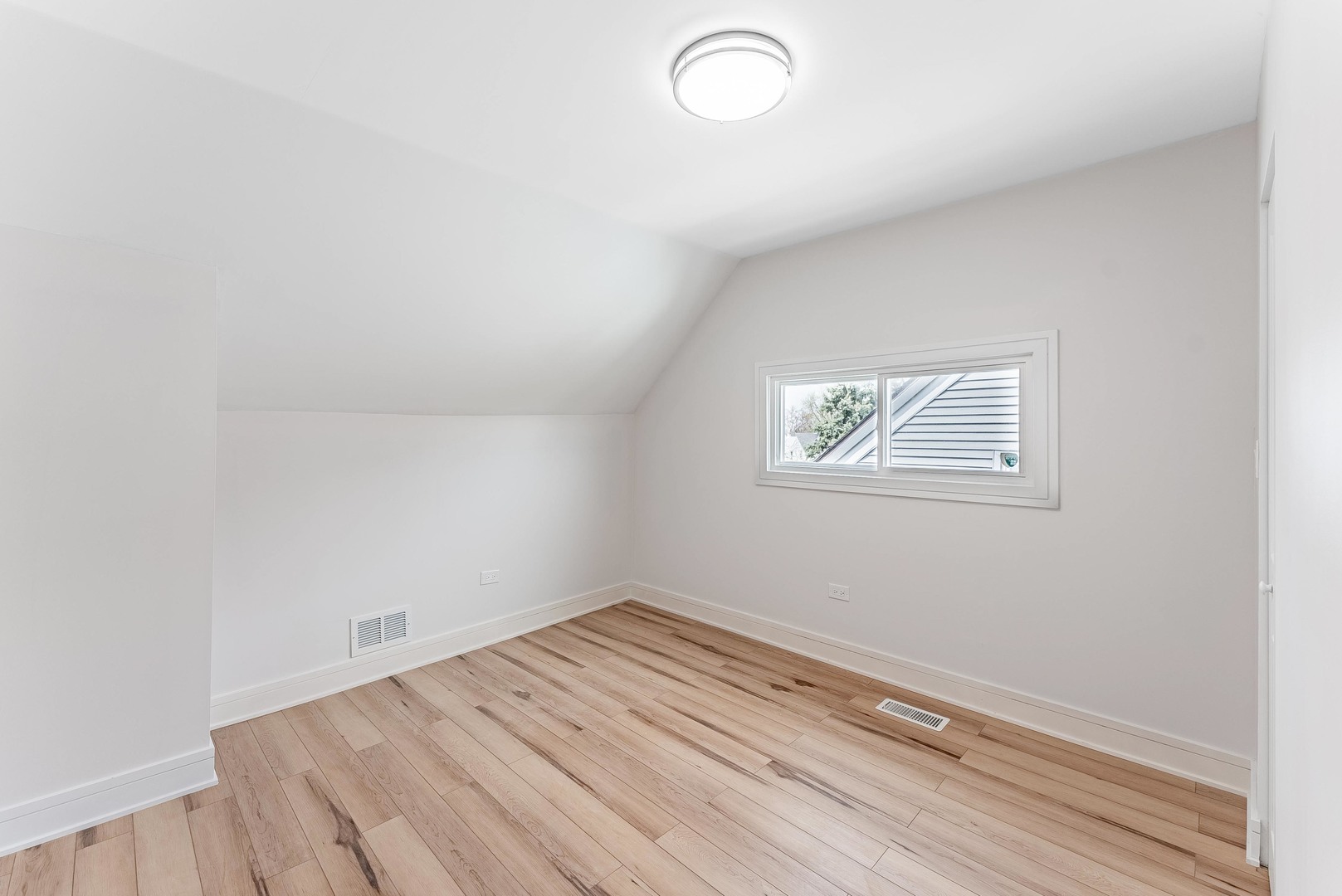 822 North Lockwood Avenue Chicago, IL 60651 - Photo 47 of 63 a view of a room with wooden floor and white walls