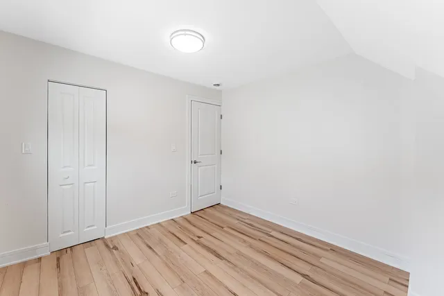 an aerial view of residential houses with outdoor space and parking