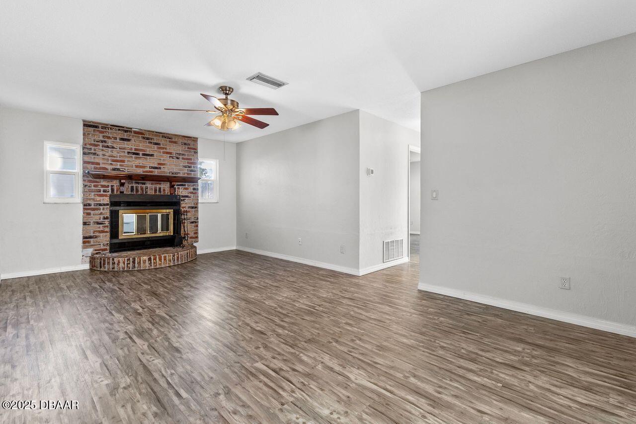 1321 Mollie Road Daytona Beach, FL 32114 - Photo 5 of 17 1321 Mollie family room with fireplace