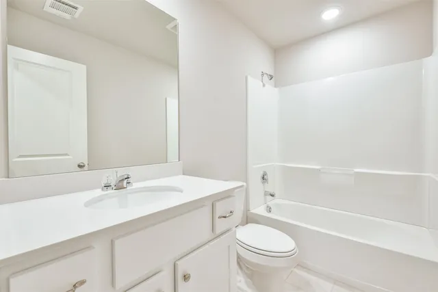 a bathroom with a sink a toilet and a bathtub