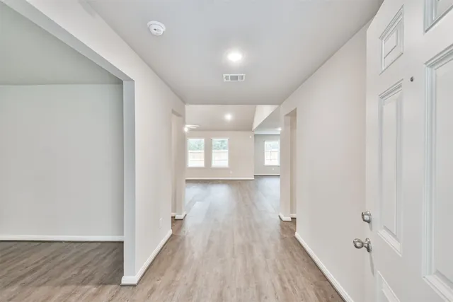 a view of gallery with wooden floor