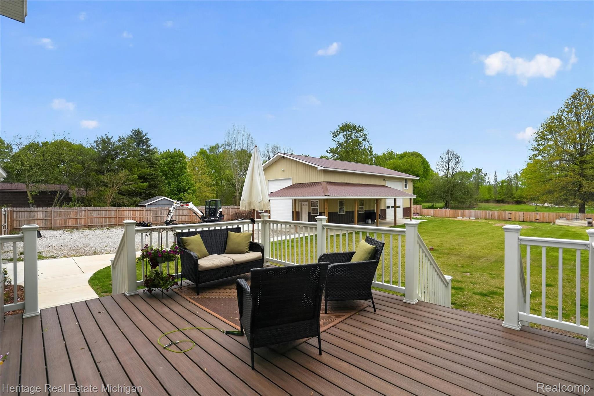 5835 Warner Road Fowlerville, MI 48836 - Photo 40 of 59 Deck featuring an outdoor structure, outdoor furniture, and a fenced backyard