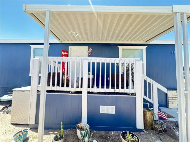 a view of a livingroom with furniture and staircase