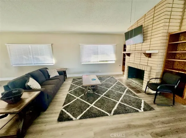 a living room with a couch and a fireplace