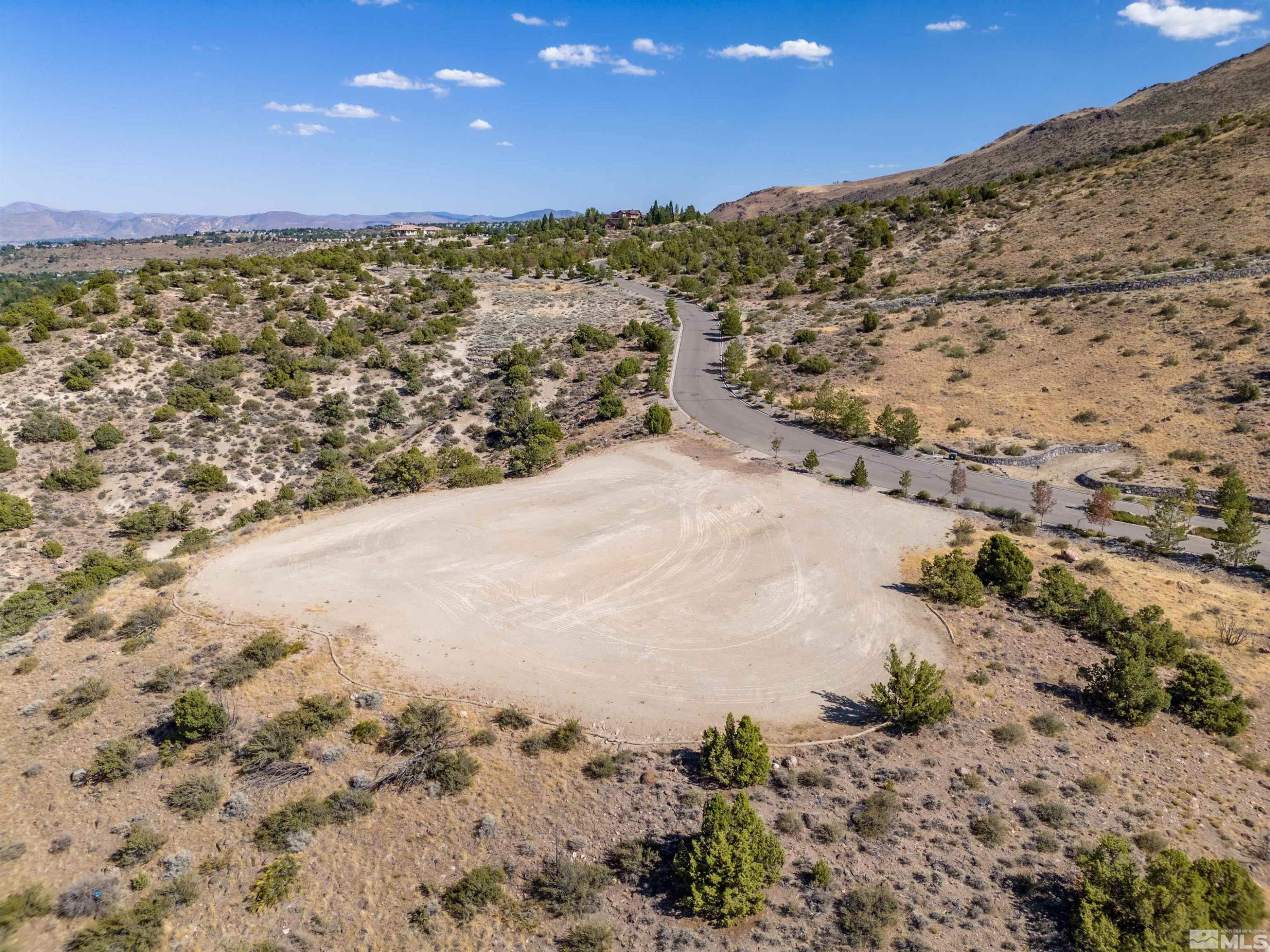 4820 Woodchuck Circle, Unit 2 Reno, NV 89519 - Photo 4 of 11 a view of a yard next to a building