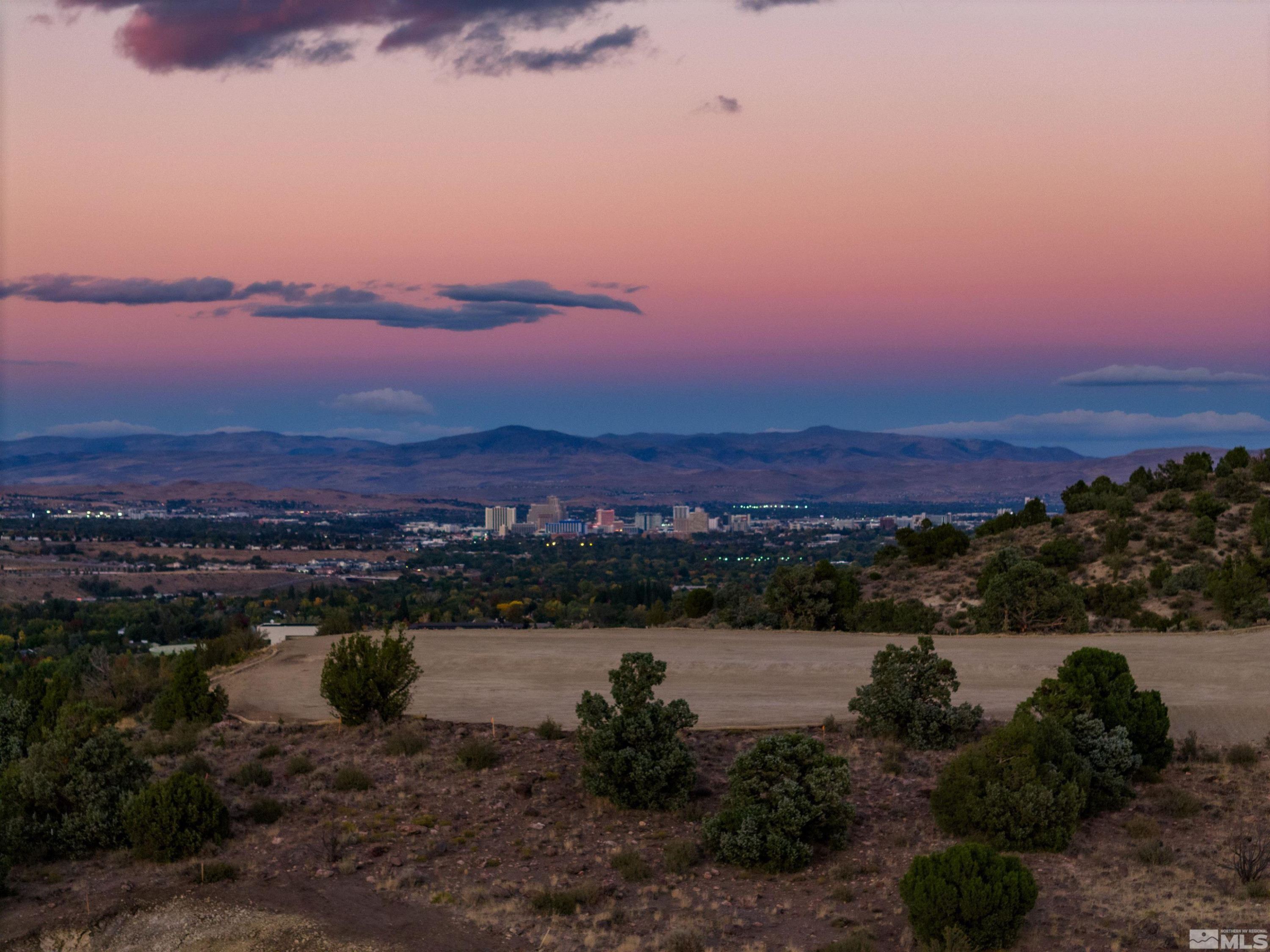 4820 Woodchuck Circle, Unit 2 Reno, NV 89519 - Photo 10 of 11 a view of a lake with sunset