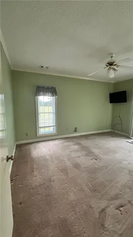 an empty room with a empty space and windows