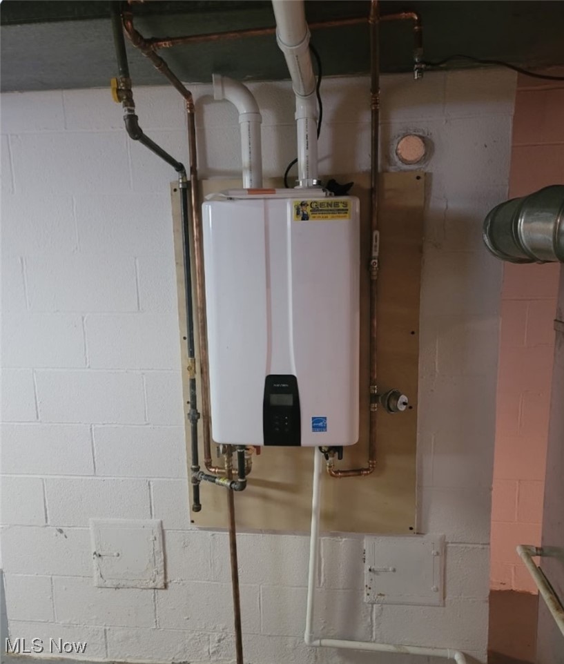 890 Wadsworth Road Medina, OH 44256 - Photo 22 of 22 Utility room with tankless water heater