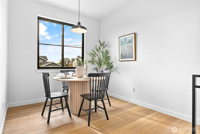 a dining room with furniture window wooden floor