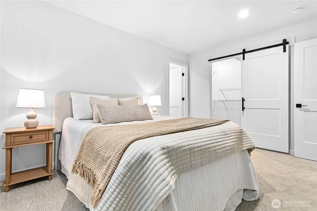 a bedroom with a bed and a walk in closet