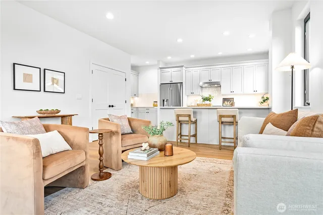 a living room with furniture and a table