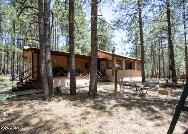 a view of a patio with chairs and a yard