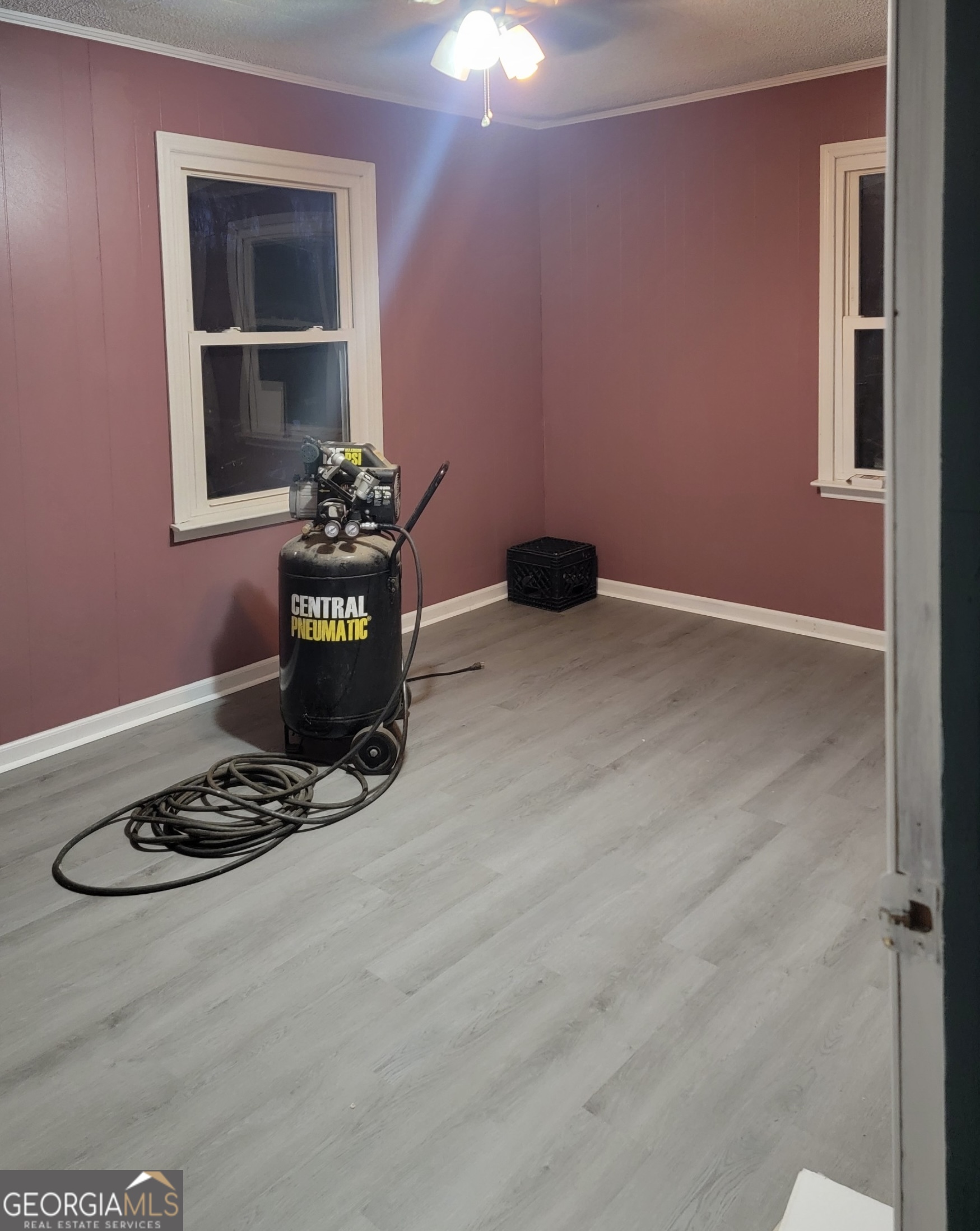 156 Brett Road Cleveland, GA 30528 - Photo 12 of 32 a view of a livingroom with wooden floor and a refrigerator