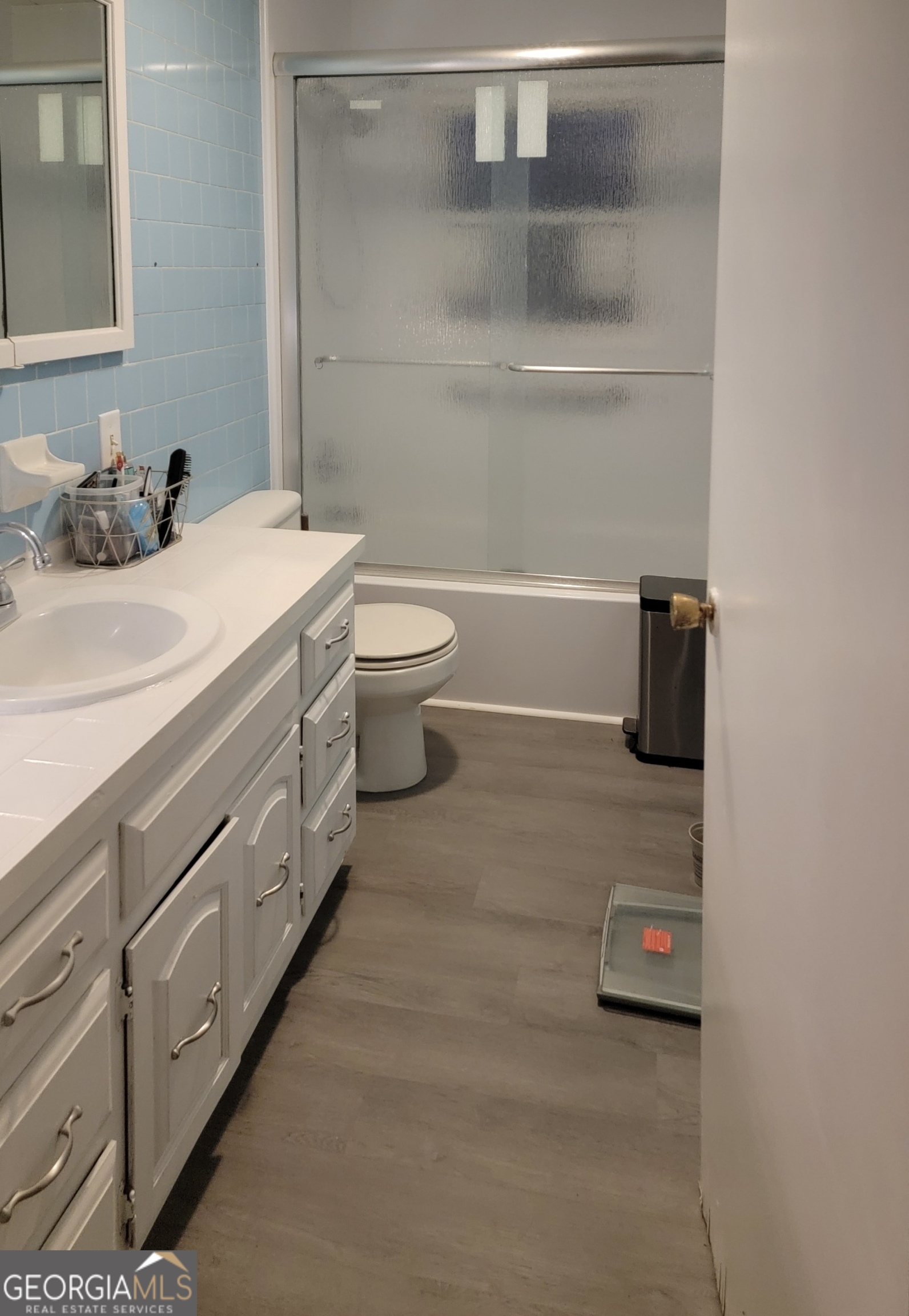 156 Brett Road Cleveland, GA 30528 - Photo 13 of 32 a bathroom with a double vanity sink and mirror