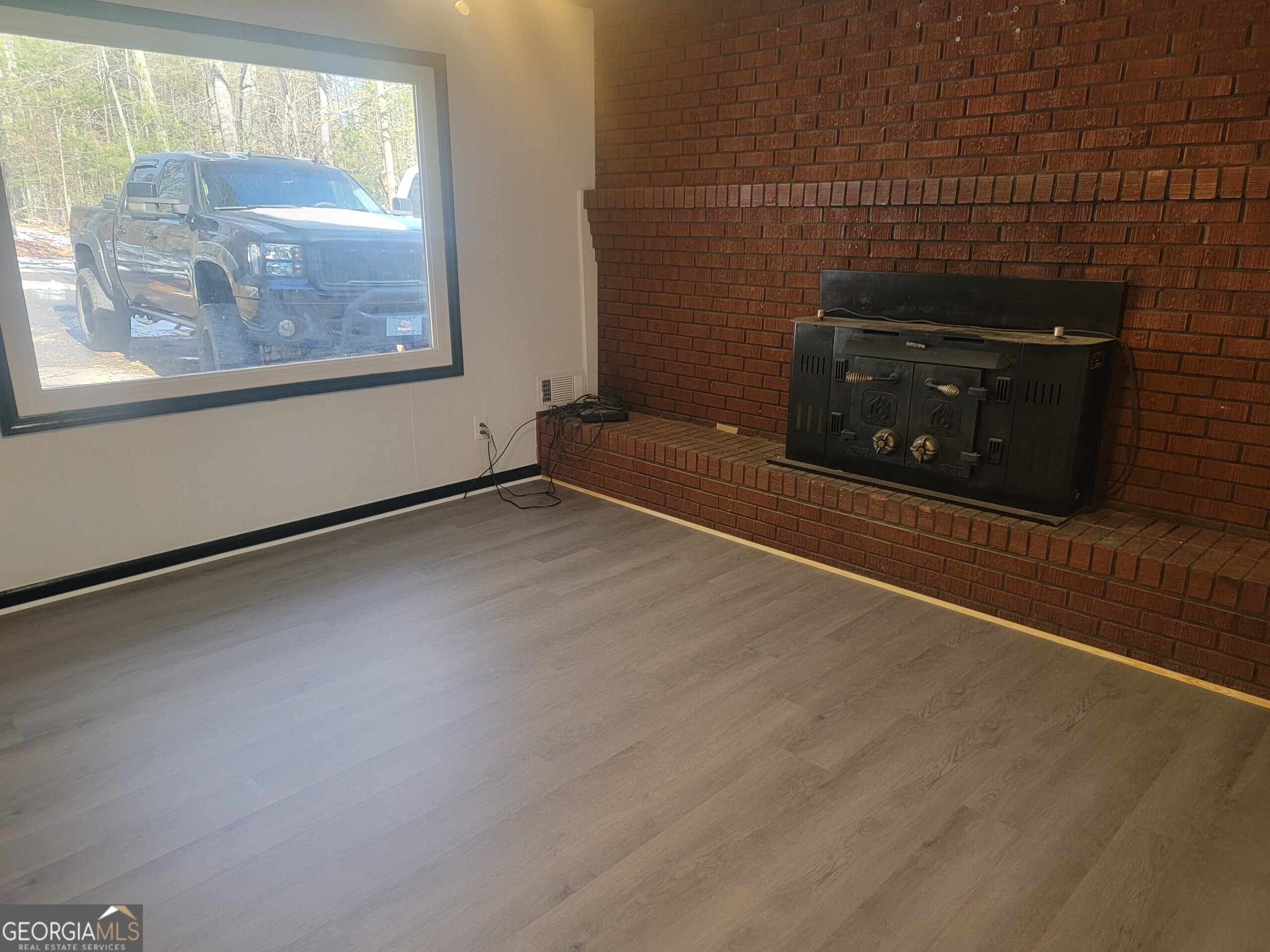 156 Brett Road Cleveland, GA 30528 - Photo 5 of 32 a view of an empty room with a window