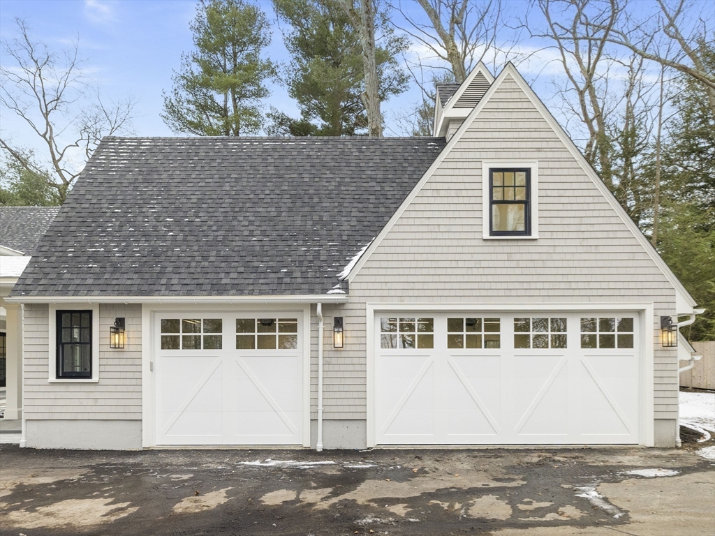 77 Forest Street Wellesley, MA 02481 - Photo 31 of 32 a front view of a house with a garage