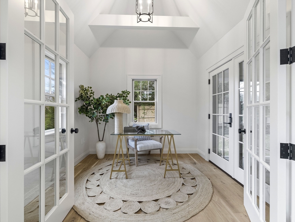 77 Forest Street Wellesley, MA 02481 - Photo 10 of 32 a room with furniture and a chandelier