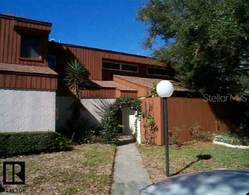 2062 Sunset Point Road, Unit 63 Clearwater, FL 33765 - Photo 1 of 1 a front view of a house with garden