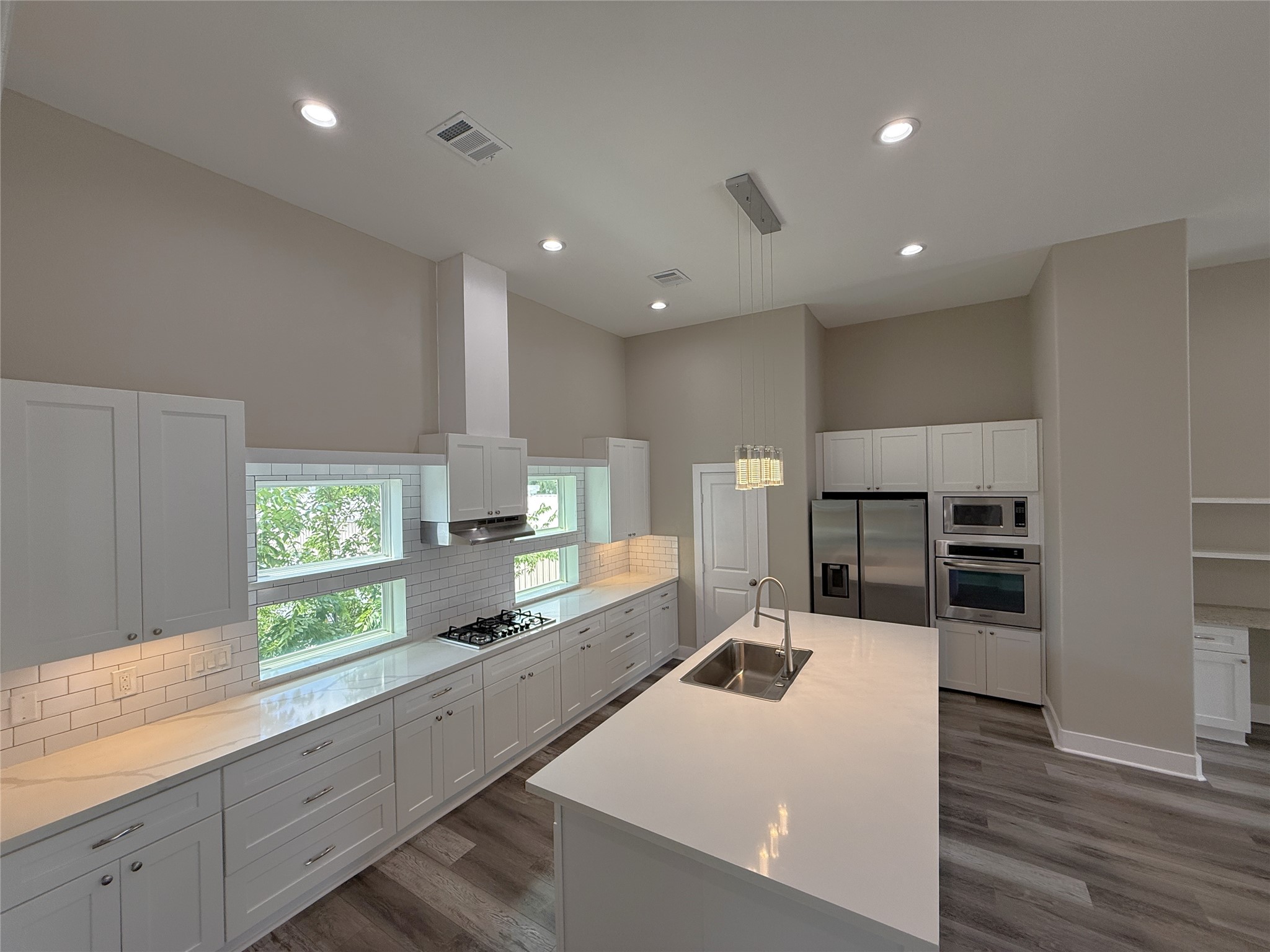 2123 Bidwell Drive Houston, TX 77018 - Photo 1 of 29 a large white kitchen with a large window
