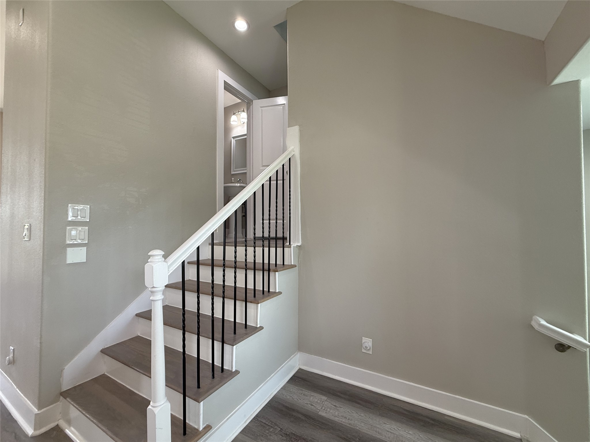 2123 Bidwell Drive Houston, TX 77018 - Photo 17 of 29 a view of staircase with wooden floor and white walls