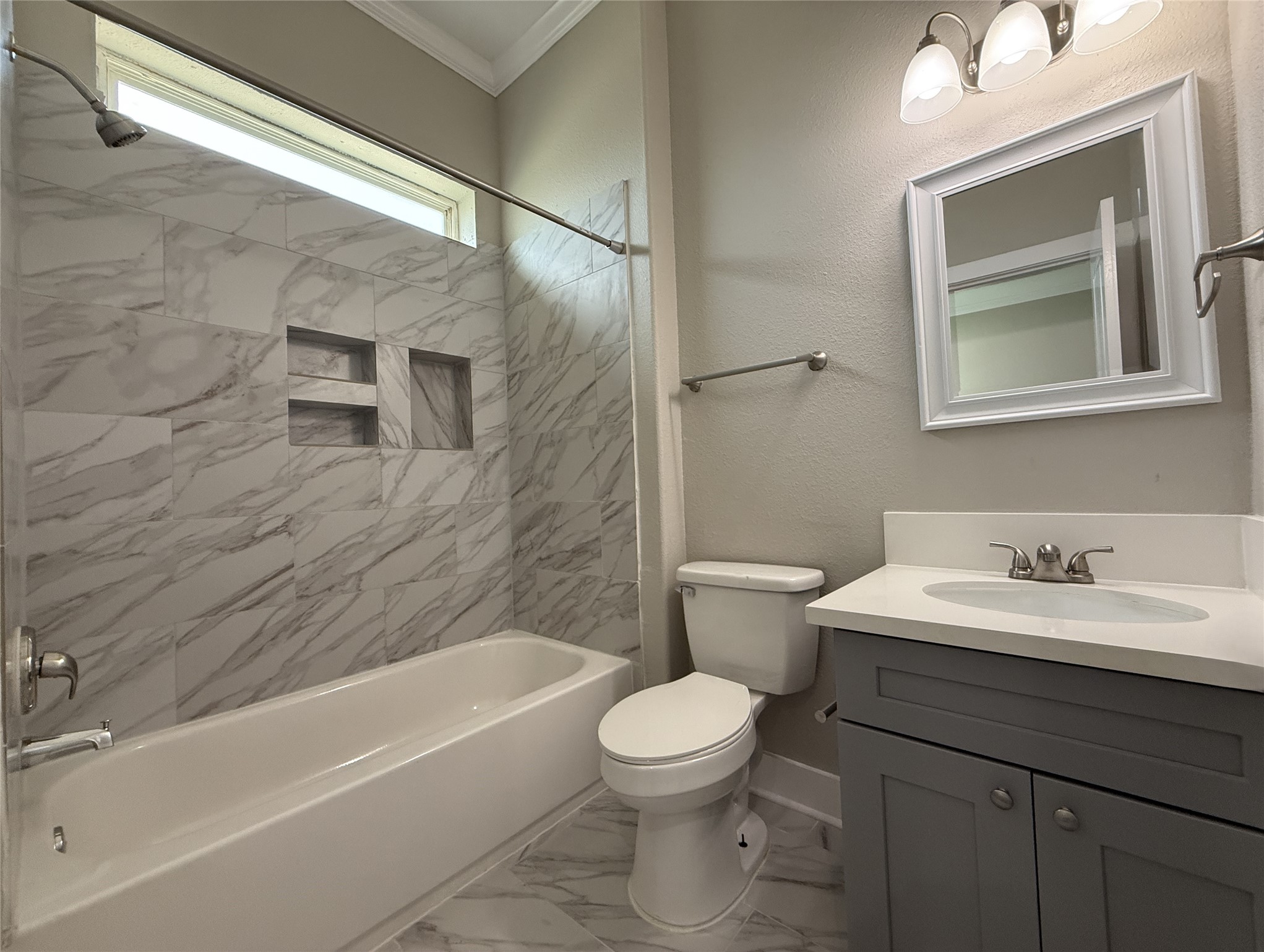 2123 Bidwell Drive Houston, TX 77018 - Photo 22 of 29 a bathroom with a toilet a sink a mirror and bathtub