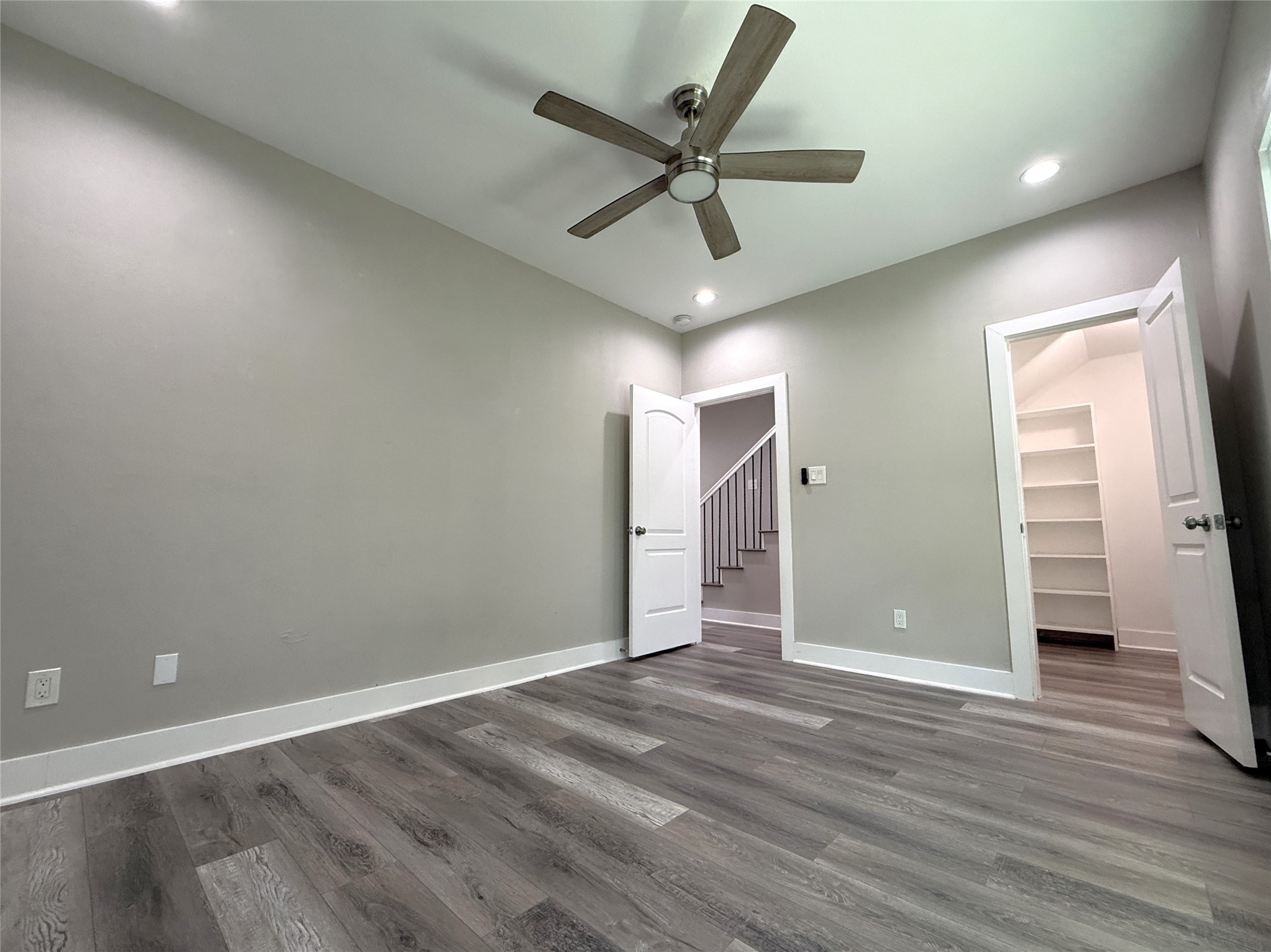 2123 Bidwell Drive Houston, TX 77018 - Photo 6 of 29 an empty room with wooden floor and windows