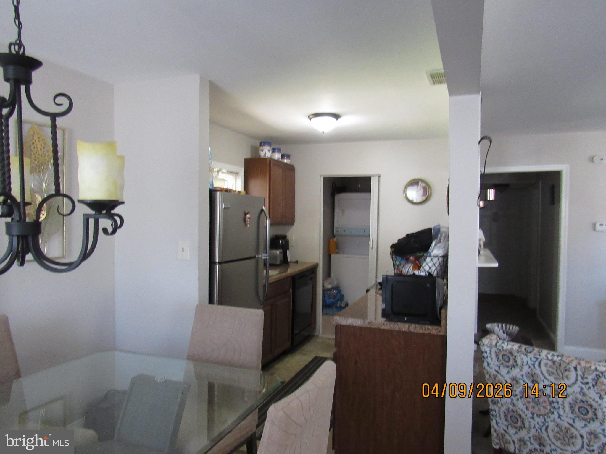 17 Lea Road New Castle, DE 19720 - Photo 12 of 17 a kitchen with stainless steel appliances kitchen island granite countertop a refrigerator and a sink