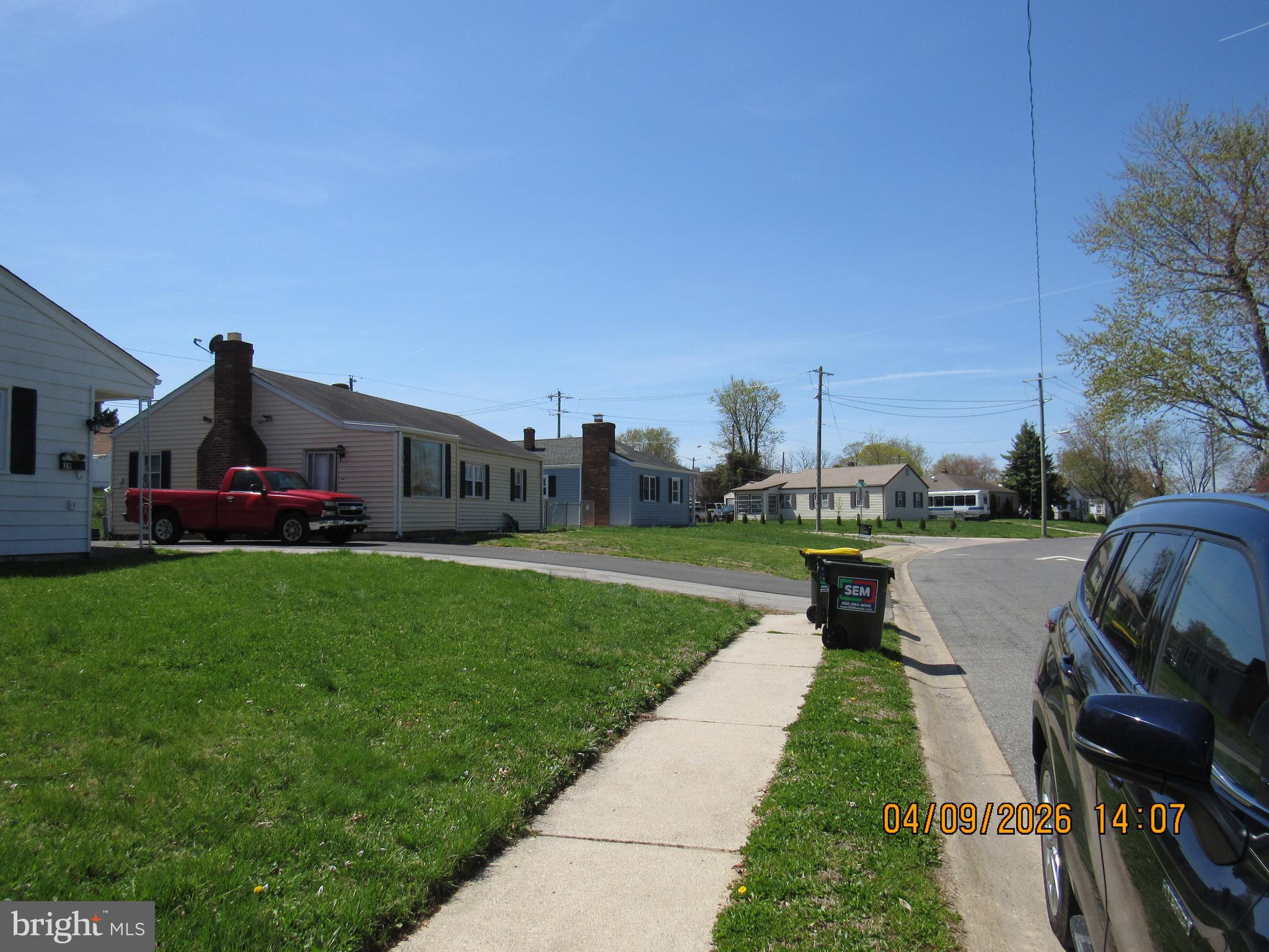 17 Lea Road New Castle, DE 19720 - Photo 13 of 17 a view of a garden with couches under an umbrella