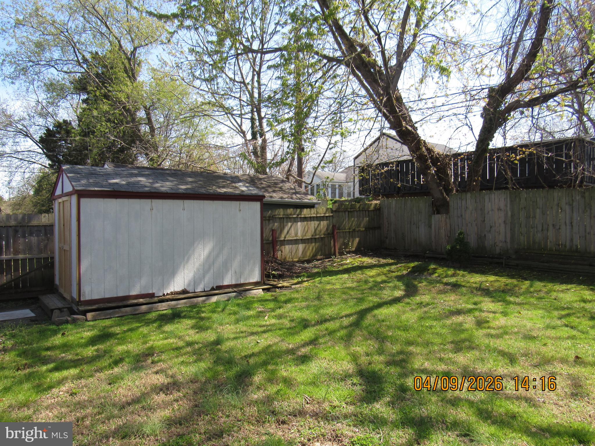 17 Lea Road New Castle, DE 19720 - Photo 17 of 17 a view of backyard with wooden fence