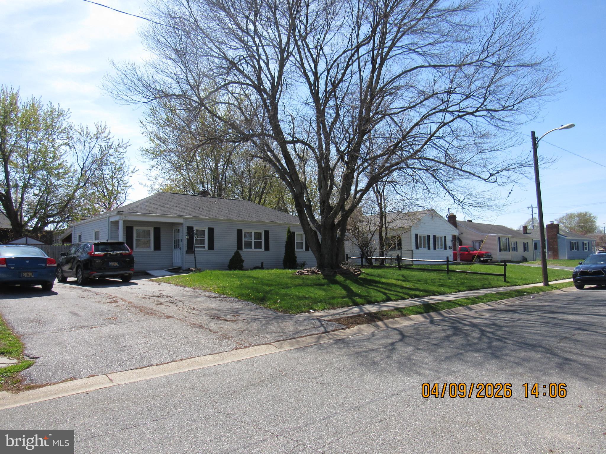17 Lea Road New Castle, DE 19720 - Photo 2 of 17 a view of a big house with a big yard and large trees