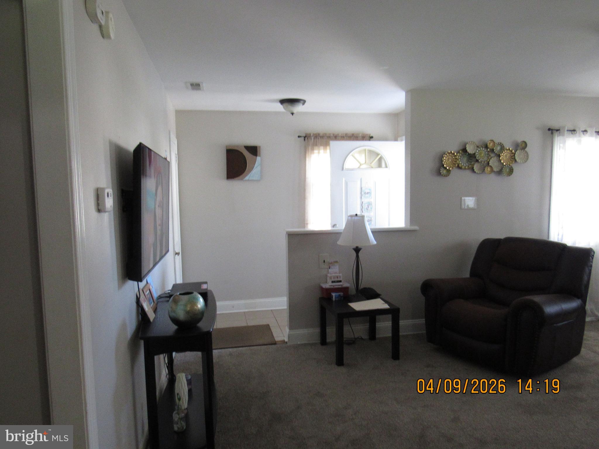 17 Lea Road New Castle, DE 19720 - Photo 5 of 17 a living room with furniture and a flat screen tv