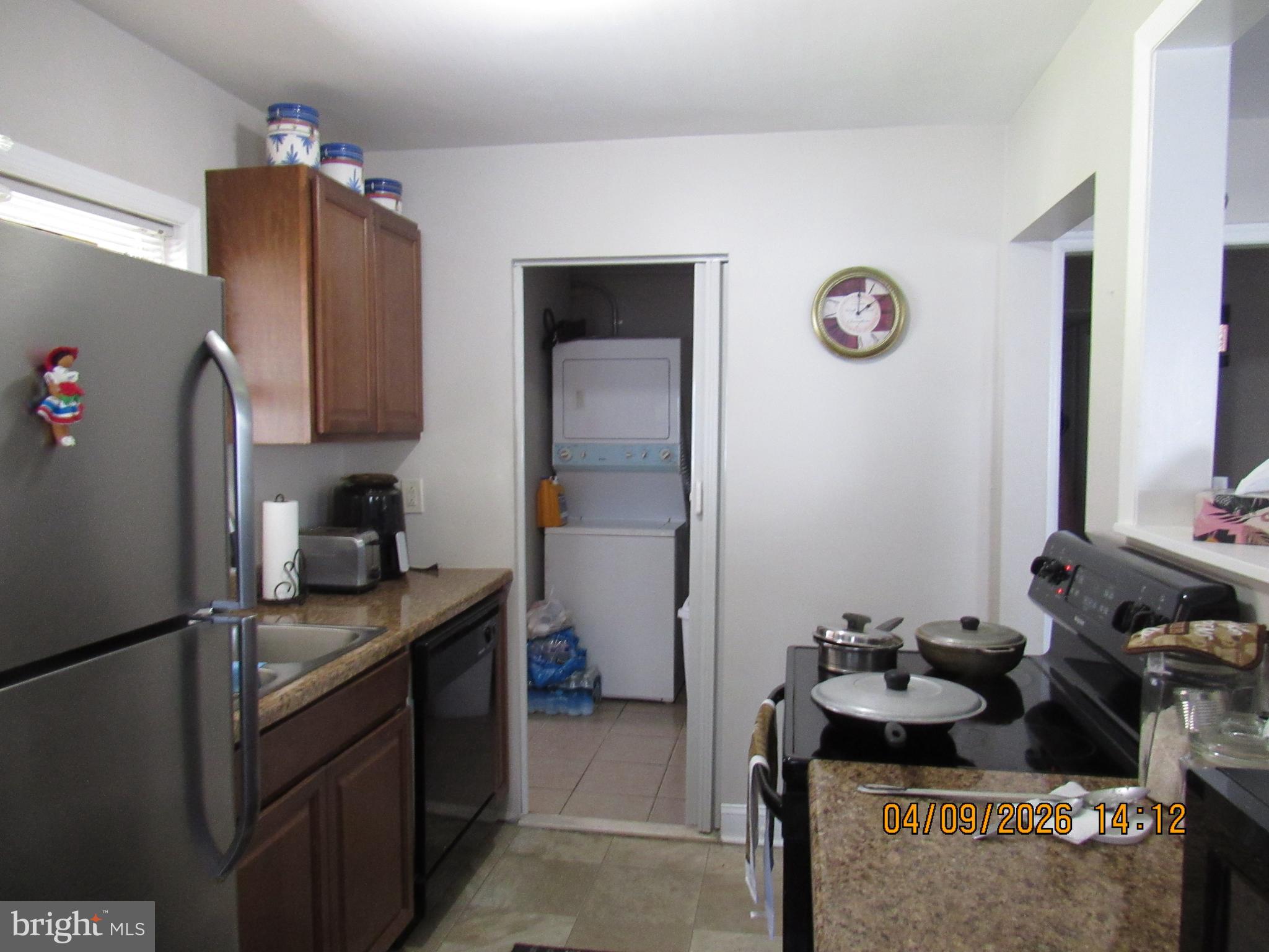 17 Lea Road New Castle, DE 19720 - Photo 8 of 17 a kitchen with a refrigerator and a stove