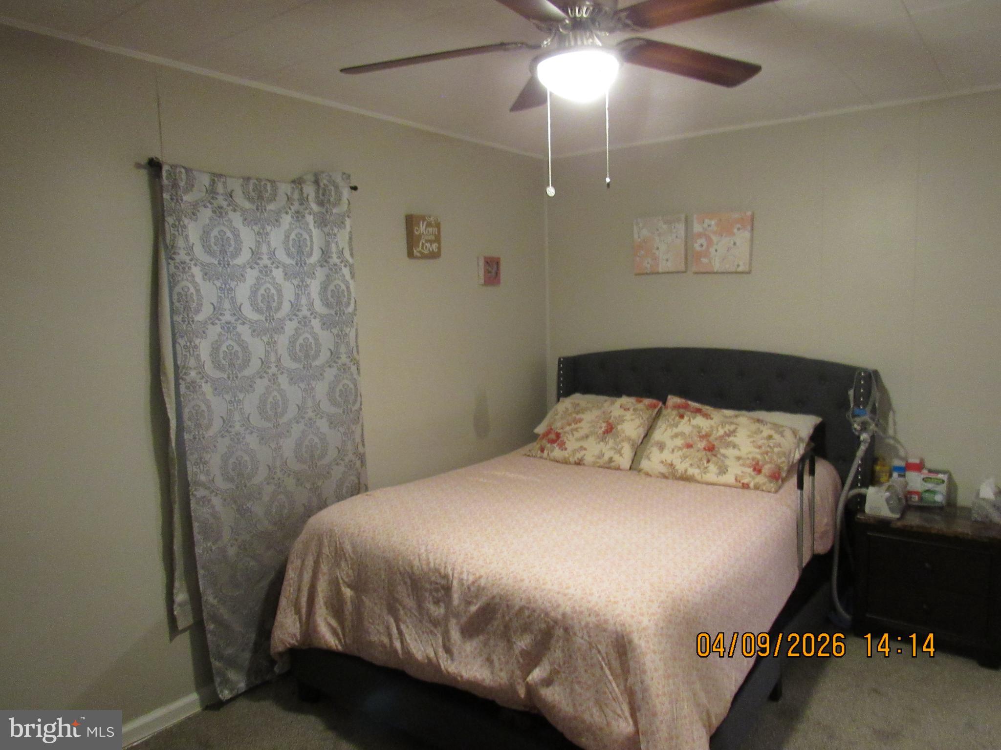 17 Lea Road New Castle, DE 19720 - Photo 10 of 17 a bedroom with a bed and a chandelier
