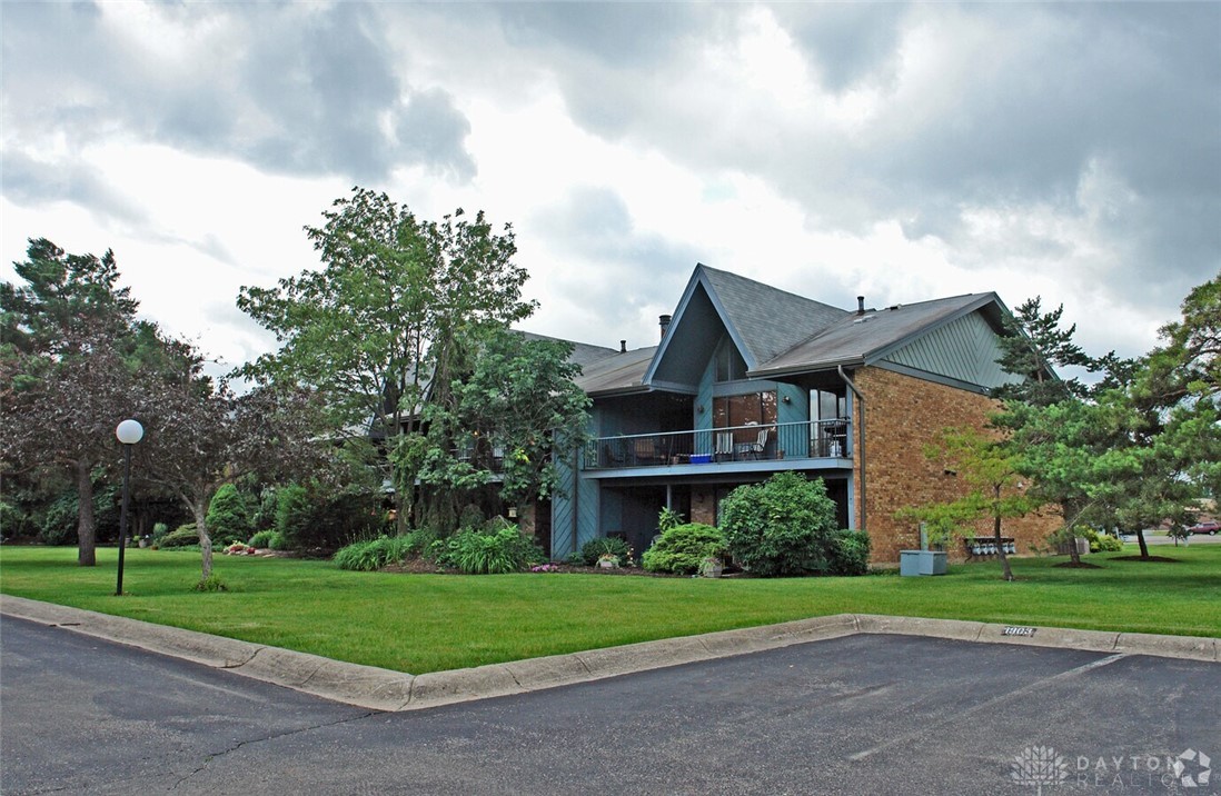1943 Washington South Road Dayton, OH 45458 - Photo 2 of 25 This multifamily dwelling offers a comfortable retreat with a lush green lawn and inviting balconies.