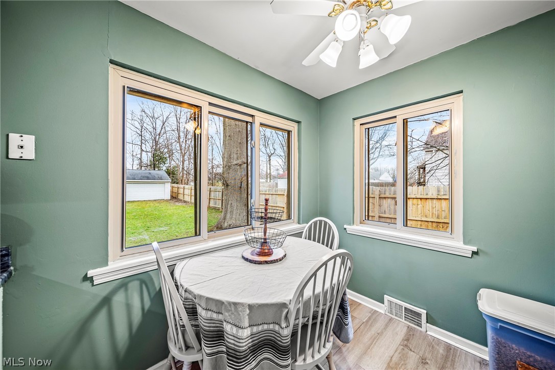 Dining area featuring ceiling fan and light hardwood / wood-style flooring