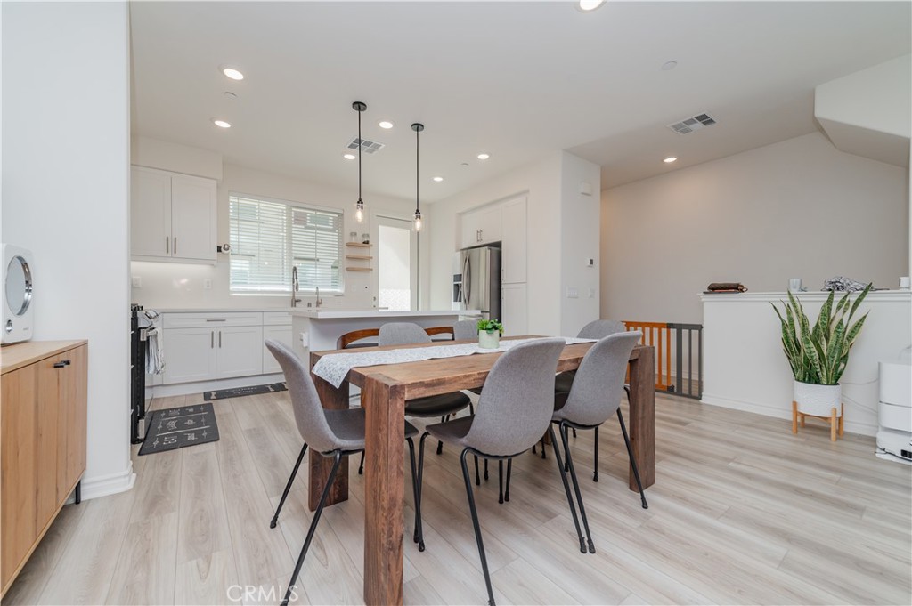 2425 Villena Way Placentia, CA 92870 - Photo 13 of 35 a view of a dining room with furniture and wooden floor