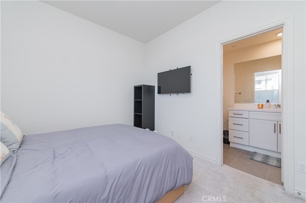 2425 Villena Way Placentia, CA 92870 - Photo 16 of 35 a bedroom with a bed and a flat screen tv