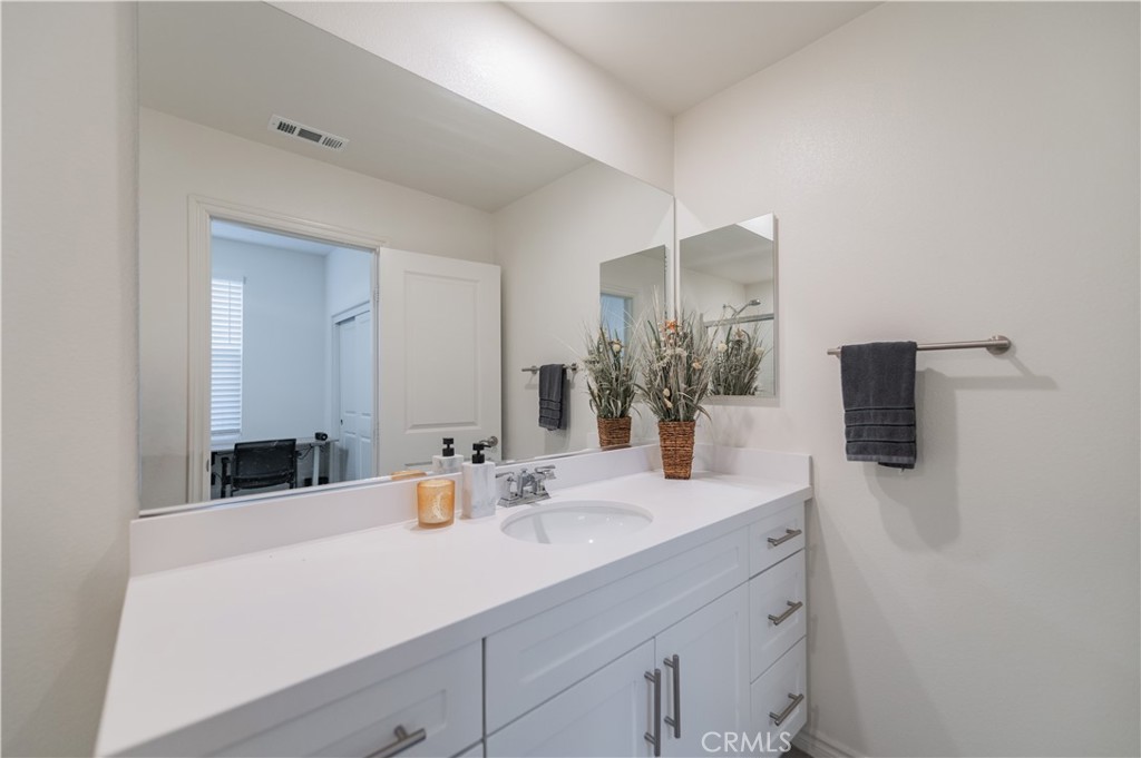 2425 Villena Way Placentia, CA 92870 - Photo 17 of 35 a bathroom with a sink and a mirror
