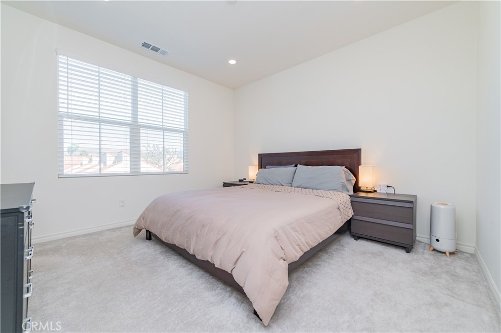 2425 Villena Way Placentia, CA 92870 - Photo 19 of 35 a bedroom with a bed and a window