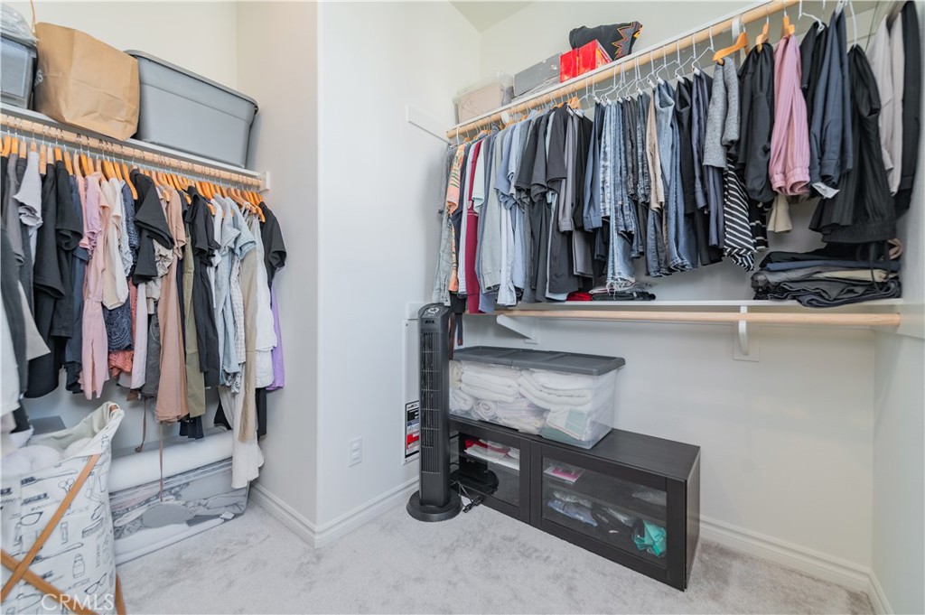 2425 Villena Way Placentia, CA 92870 - Photo 20 of 35 a view of walk in closet with clothes and shoes